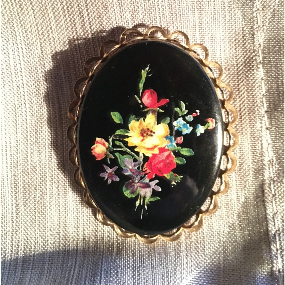 Black brooch with hand painted flowers